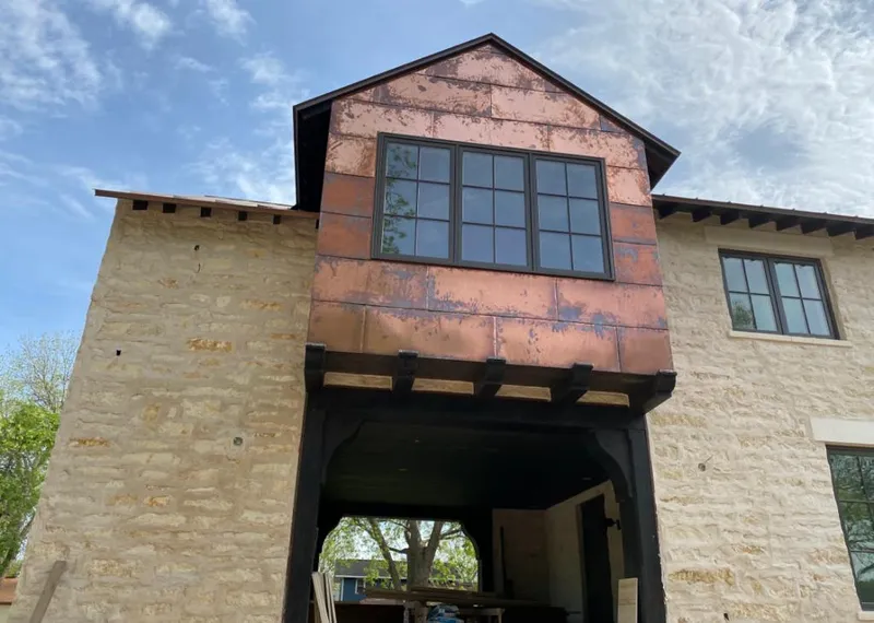 Copper metal panel facade on a stone building for Roof Repair in Hemet